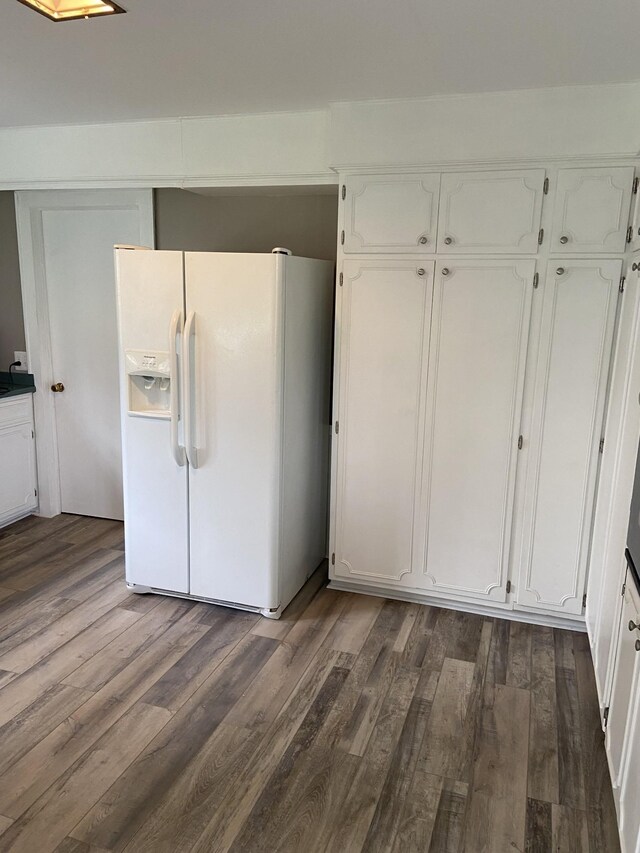 11495 Guthrie Rd, Guthrie, KY 42234 - kitchen featuring white cabinetry, dark wood-style floors, and white refrigerator with ice dispenser