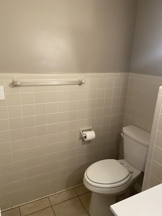 11495 Guthrie Rd, Guthrie, KY 42234 - half bath with toilet, tile walls, and tile patterned flooring