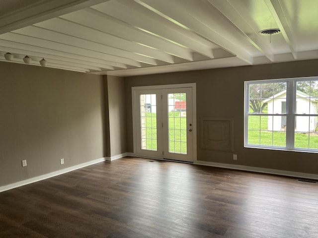 11495 Guthrie Rd, Guthrie, KY 42234 - unfurnished room with baseboards, dark wood finished floors, beam ceiling, and visible vents