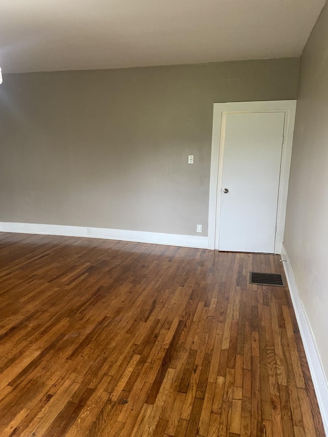 11495 Guthrie Rd, Guthrie, KY 42234 - empty room featuring baseboards, visible vents, and dark wood-type flooring