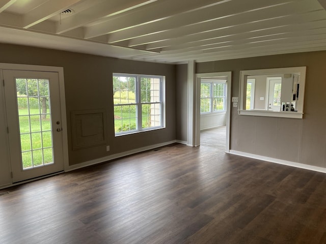 11495 Guthrie Rd, Guthrie, KY 42234 - unfurnished living room featuring baseboards, beamed ceiling, and dark wood-style flooring