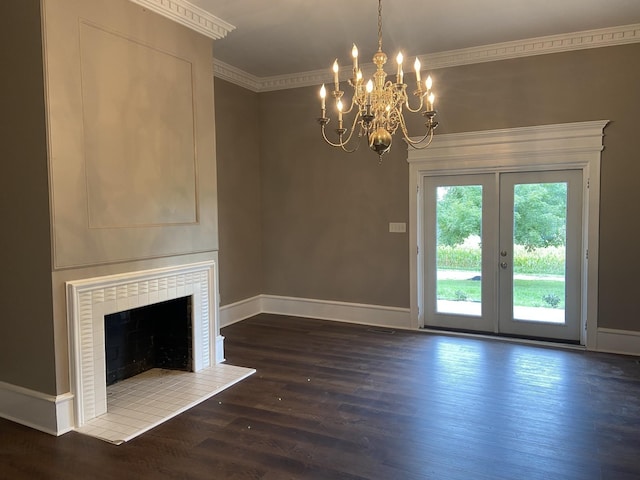 11495 Guthrie Rd, Guthrie, KY 42234 - unfurnished living room with an inviting chandelier, ornamental molding, french doors, and wood finished floors