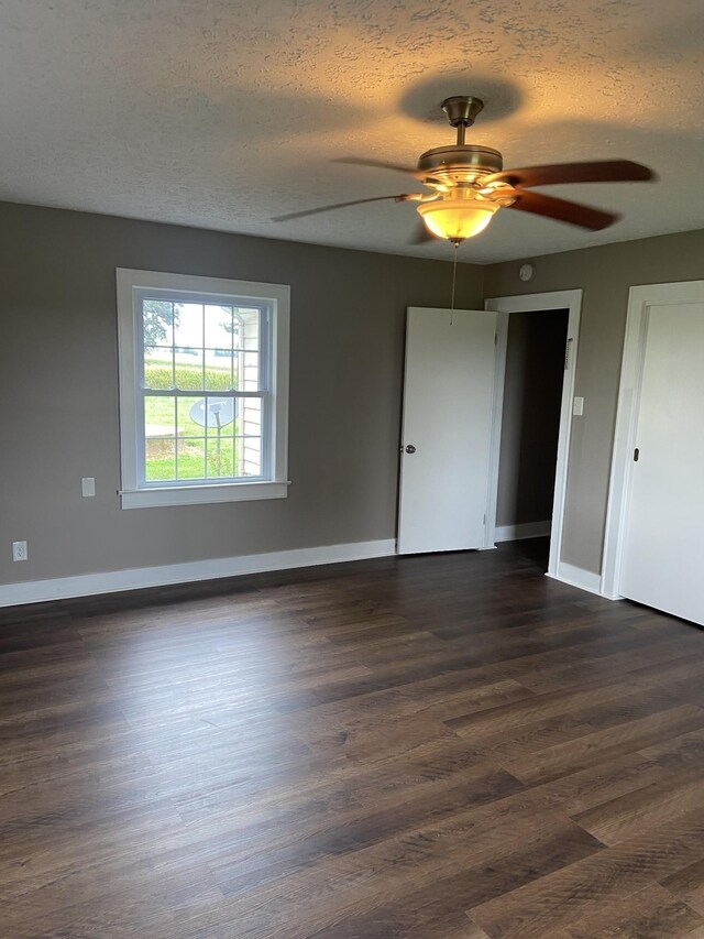 11495 Guthrie Rd, Guthrie, KY 42234 - unfurnished room with a textured ceiling, ceiling fan, and dark wood-style floors