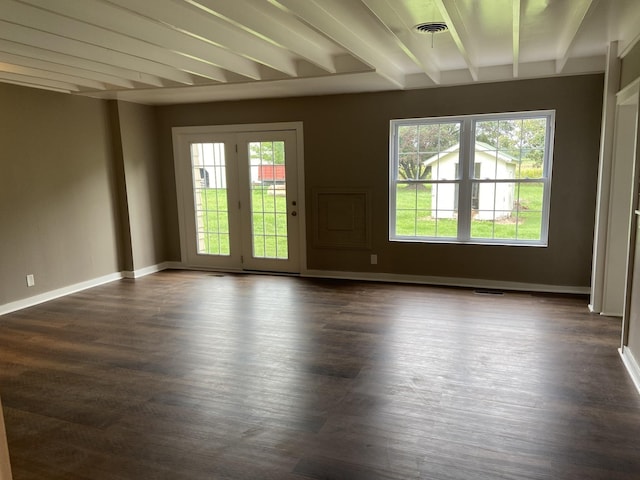 11495 Guthrie Rd, Guthrie, KY 42234 - unfurnished room featuring baseboards, dark wood-style floors, beam ceiling, and visible vents