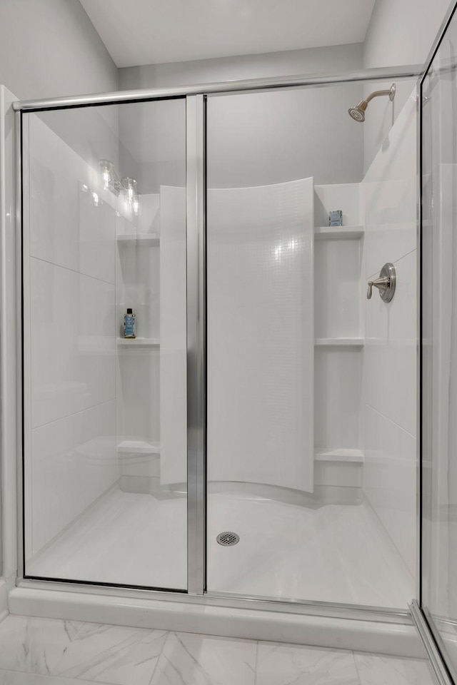 952 Pleasant Ridge Run, Mount Juliet, TN 37122 - bathroom with marble look tiles and a stall shower