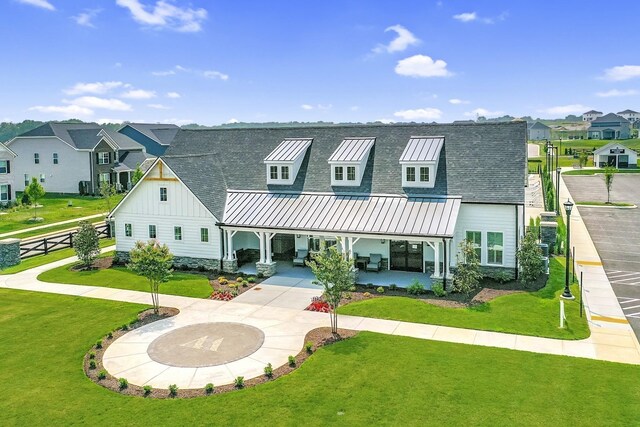 952 Pleasant Ridge Run, Mount Juliet, TN 37122 - view of front facade featuring board and batten siding, a residential view, a front yard, a patio area, and roof with shingles