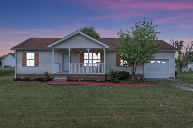 ranch-style home featuring a garage, covered porch, a front lawn, and crawl space