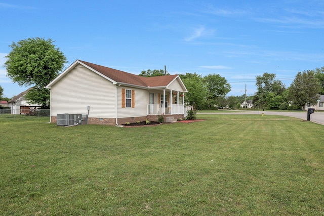 view of home's exterior with fence, central AC, crawl space, a lawn, and covered porch
