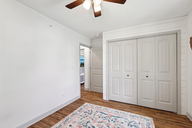 557 Skyview Dr, Ashland City, TN 37015 - bedroom with a closet, a ceiling fan, baseboards, and wood finished floors