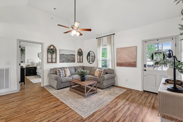 557 Skyview Dr, Ashland City, TN 37015 - living area with light wood-style floors, plenty of natural light, lofted ceiling, and visible vents