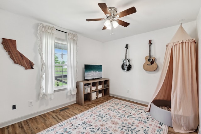 557 Skyview Dr, Ashland City, TN 37015 - game room with a ceiling fan, baseboards, visible vents, and wood finished floors
