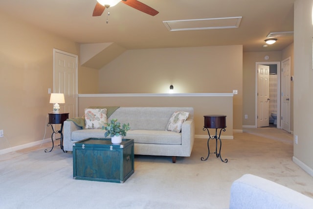 living room with light colored carpet, attic access, baseboards, and ceiling fan