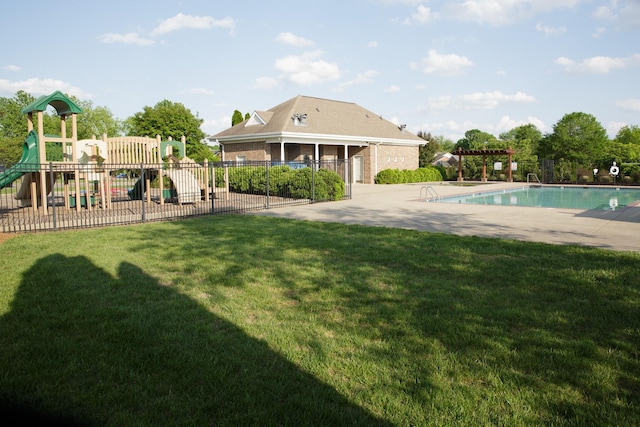 exterior space featuring fence, a lawn, a patio area, and playground community