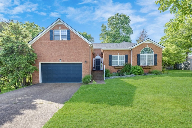 view of front of home with a garage, brick siding, a front lawn, and aphalt driveway