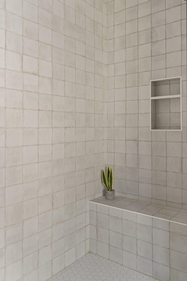bathroom featuring a tile shower