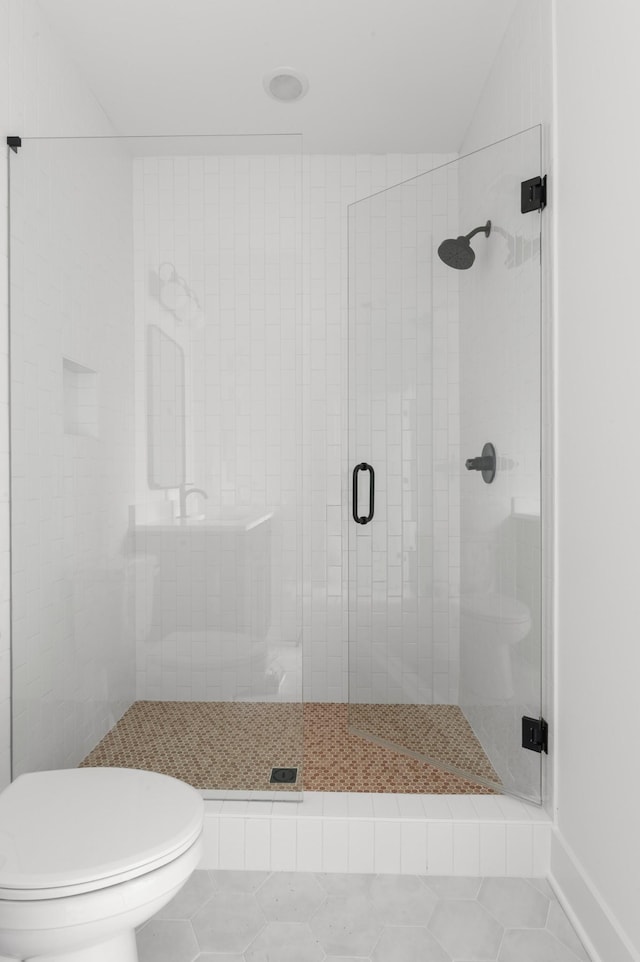 428 Mercomatic Dr, Nashville, TN 37209 - bathroom with a stall shower, toilet, and tile patterned floors