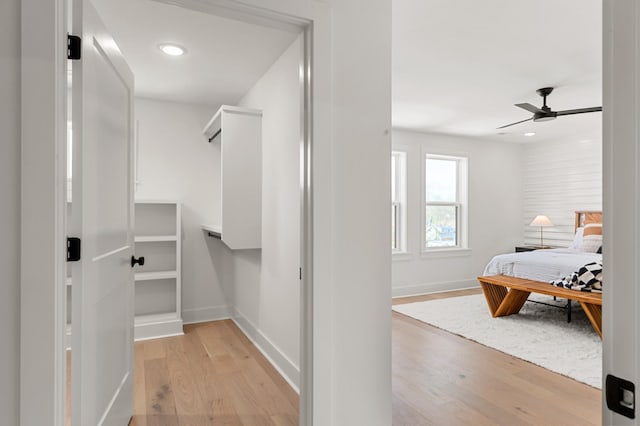 interior space featuring light wood-style floors and ceiling fan
