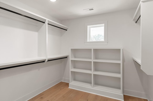 walk in closet featuring light wood-style floors and visible vents