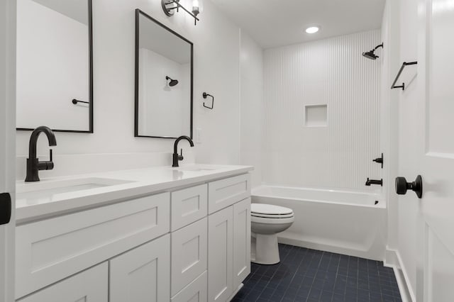 full bathroom featuring a sink, tile patterned floors, toilet, and bathing tub / shower combination