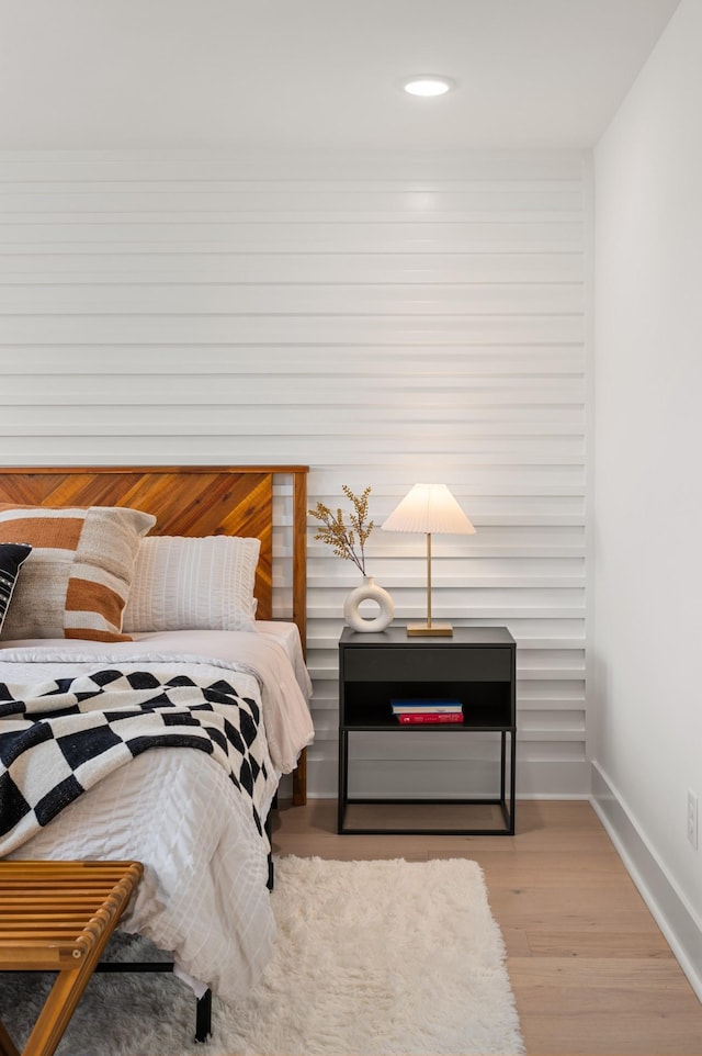 bedroom with baseboards, recessed lighting, and wood finished floors