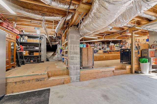 unfinished basement featuring a workshop area