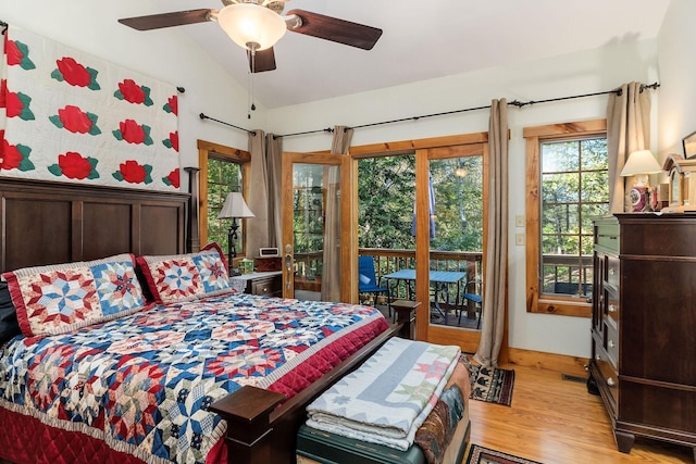 bedroom with a ceiling fan, light wood-style flooring, lofted ceiling, and access to exterior