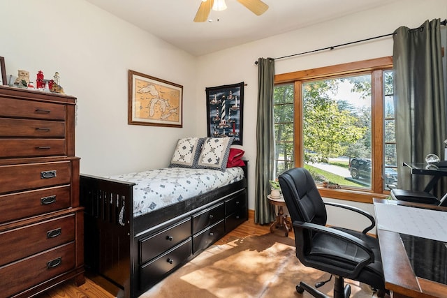 bedroom featuring ceiling fan and wood finished floors