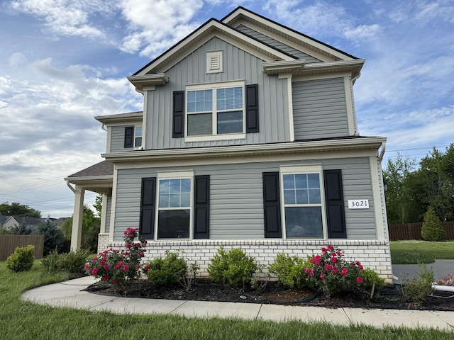 view of front of home featuring fence and board and batten siding