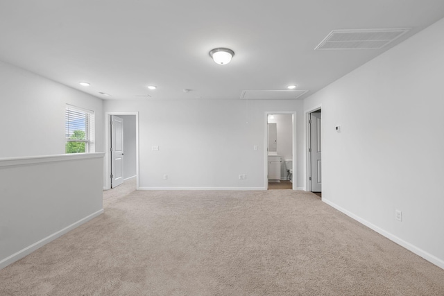 3021 Posada Ct, Spring Hill, TN 37174 - unfurnished room with visible vents, attic access, baseboards, and light colored carpet