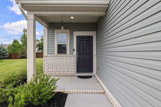 3021 Posada Ct, Spring Hill, TN 37174 - entrance to property featuring a lawn, fence, and brick siding