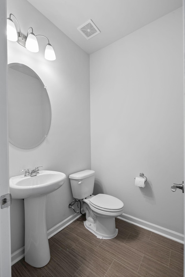 3021 Posada Ct, Spring Hill, TN 37174 - half bath with baseboards, toilet, and visible vents