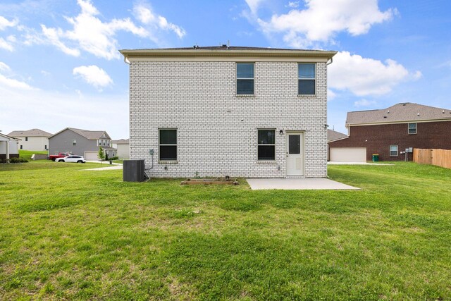 3021 Posada Ct, Spring Hill, TN 37174 - back of property featuring brick siding, a patio area, a yard, and cooling unit