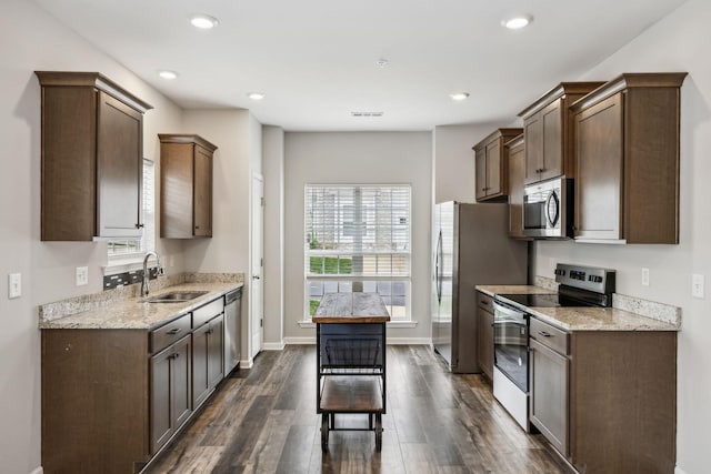 100 Bergen Dr, Spring Hill, TN 37174 - kitchen featuring a sink, appliances with stainless steel finishes, dark wood-style flooring, and a wealth of natural light