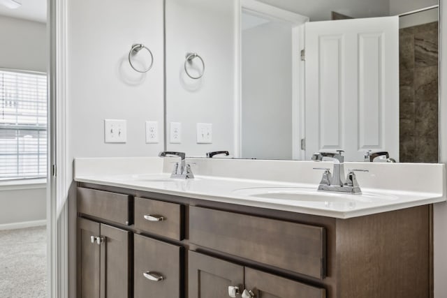 100 Bergen Dr, Spring Hill, TN 37174 - full bathroom featuring double vanity, baseboards, and a sink