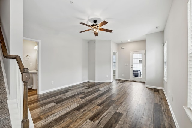 100 Bergen Dr, Spring Hill, TN 37174 - unfurnished living room featuring a sink, a ceiling fan, baseboards, dark wood-type flooring, and stairway
