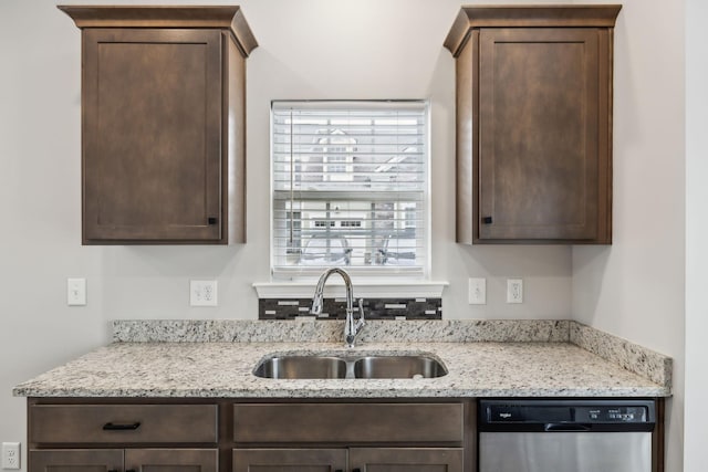 100 Bergen Dr, Spring Hill, TN 37174 - kitchen featuring light stone counters, a sink, dishwasher, and dark brown cabinets
