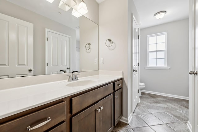 100 Bergen Dr, Spring Hill, TN 37174 - bathroom featuring toilet, baseboards, and vanity
