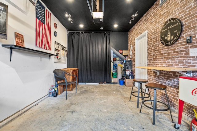 100 Bergen Dr, Spring Hill, TN 37174 - miscellaneous room featuring brick wall and concrete floors