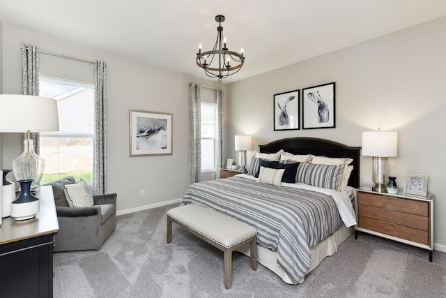 carpeted bedroom with an inviting chandelier, baseboards, and multiple windows