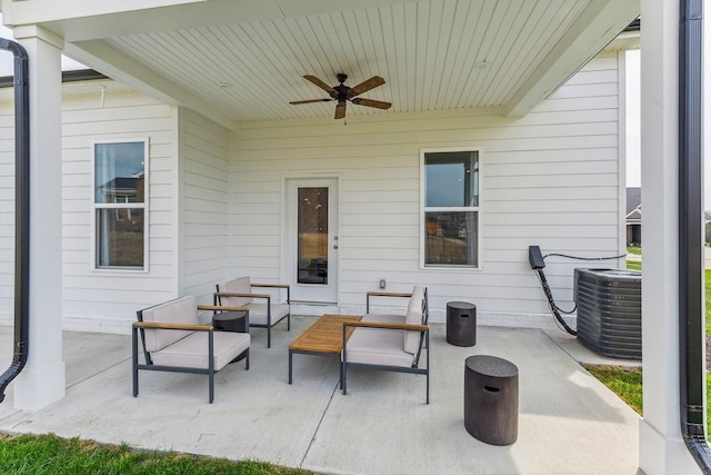 view of patio / terrace with an outdoor living space, a ceiling fan, and central AC unit