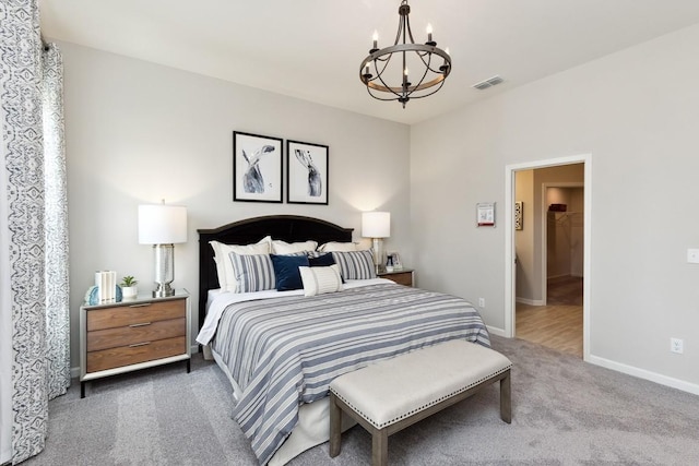 carpeted bedroom with visible vents, baseboards, and an inviting chandelier