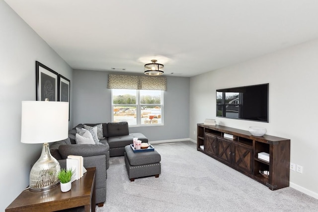 carpeted living room with baseboards and visible vents