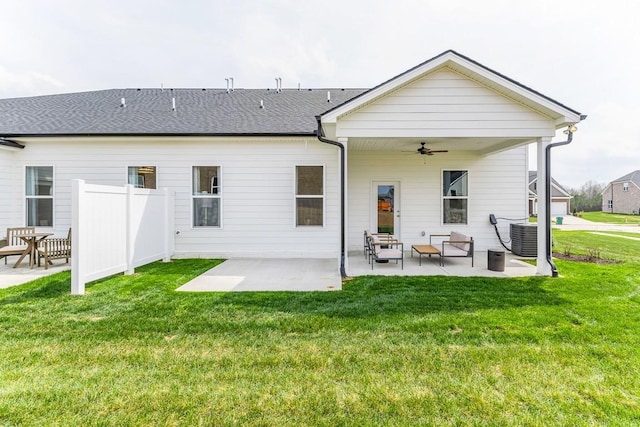 back of house featuring fence, cooling unit, a patio area, a ceiling fan, and a yard