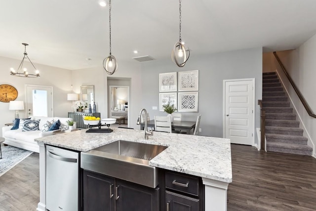 kitchen featuring visible vents, dark wood-style flooring, open floor plan, a sink, and dishwasher