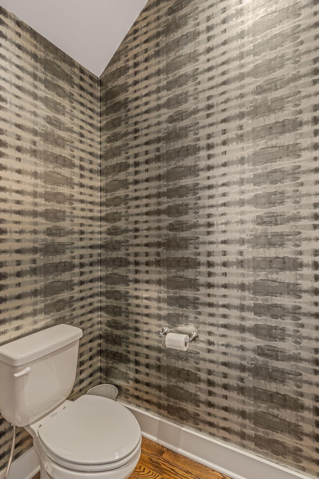 6328B Columbia Ave, Nashville, TN 37209 - bathroom with baseboards, wallpapered walls, vaulted ceiling, and toilet