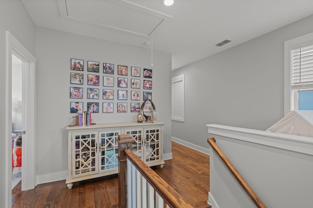 6328B Columbia Ave, Nashville, TN 37209 - hall with attic access, baseboards, an upstairs landing, visible vents, and dark wood-style floors