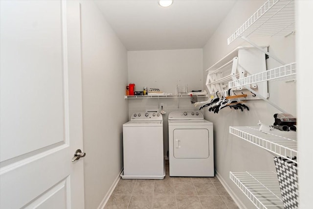 3294 Holiday Ln, Columbia, TN 38401 - clothes washing area with light tile patterned floors, baseboards, laundry area, and washer and dryer