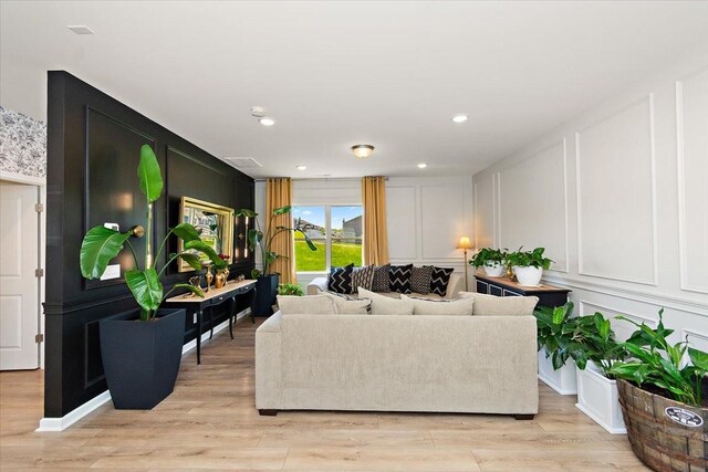 3294 Holiday Ln, Columbia, TN 38401 - living area with a decorative wall, recessed lighting, and light wood-style flooring