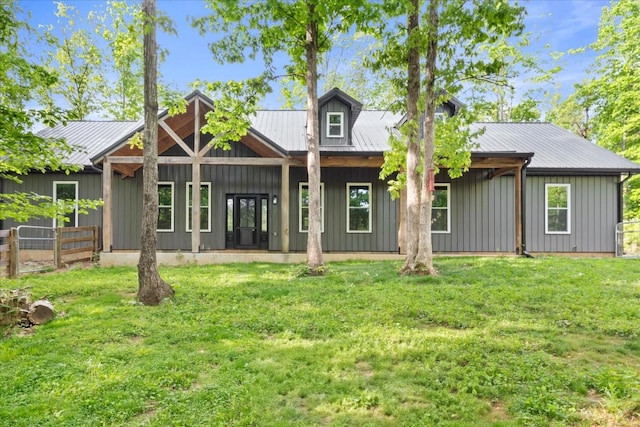 8360 Pinewood Rd, Lyles, TN 37098 - rear view of property with fence, board and batten siding, and metal roof