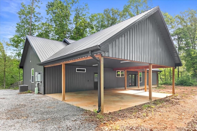 8360 Pinewood Rd, Lyles, TN 37098 - back of property featuring a carport, central AC, and metal roof